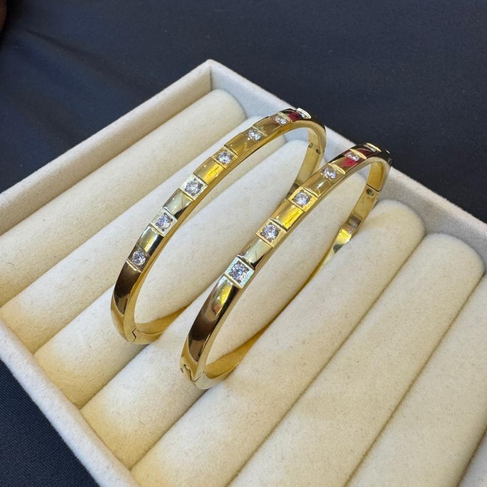 Gold bracelet with diamond studs